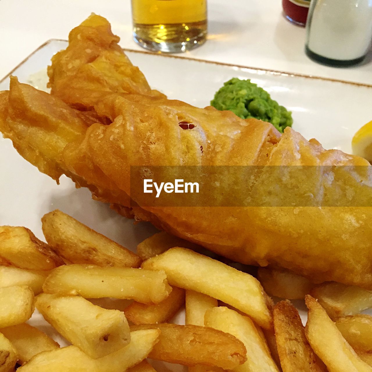 Close-up of fish and chips in plate