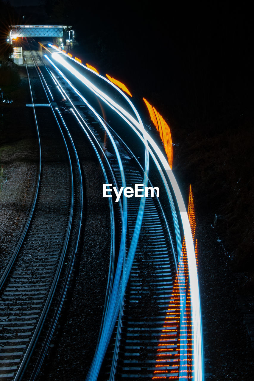 High angle view of light trails on road at night