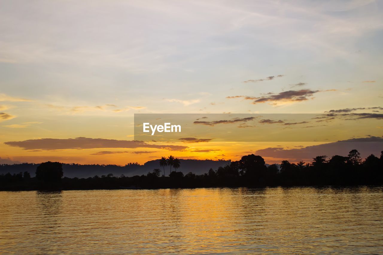 Scenic view of lake against sky during sunset