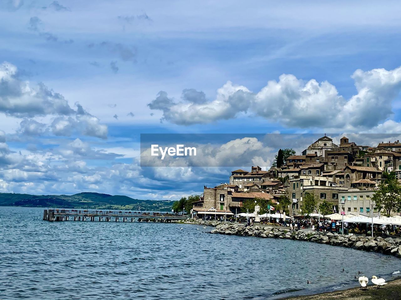 PANORAMIC VIEW OF SEA AND BUILDINGS AGAINST SKY