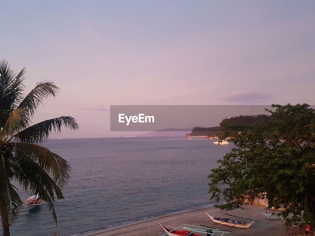 SCENIC VIEW OF SWIMMING POOL AGAINST SKY DURING SUNSET