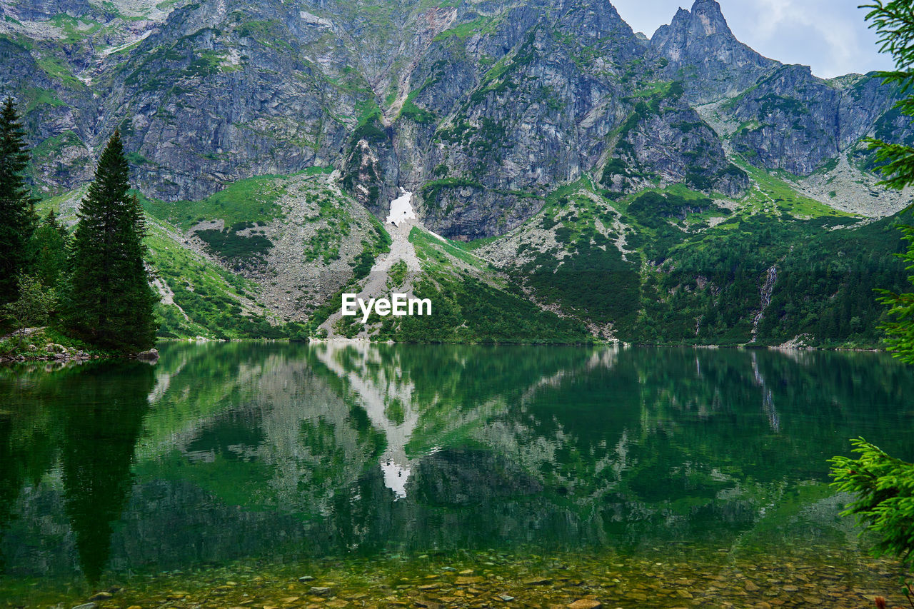 Mountains range near beautiful lake. tatra national park in poland. morskie oko or sea eye lake