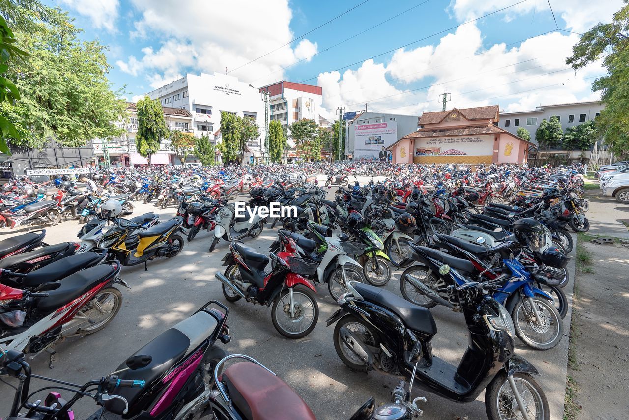 Bicycles parked on road against buildings