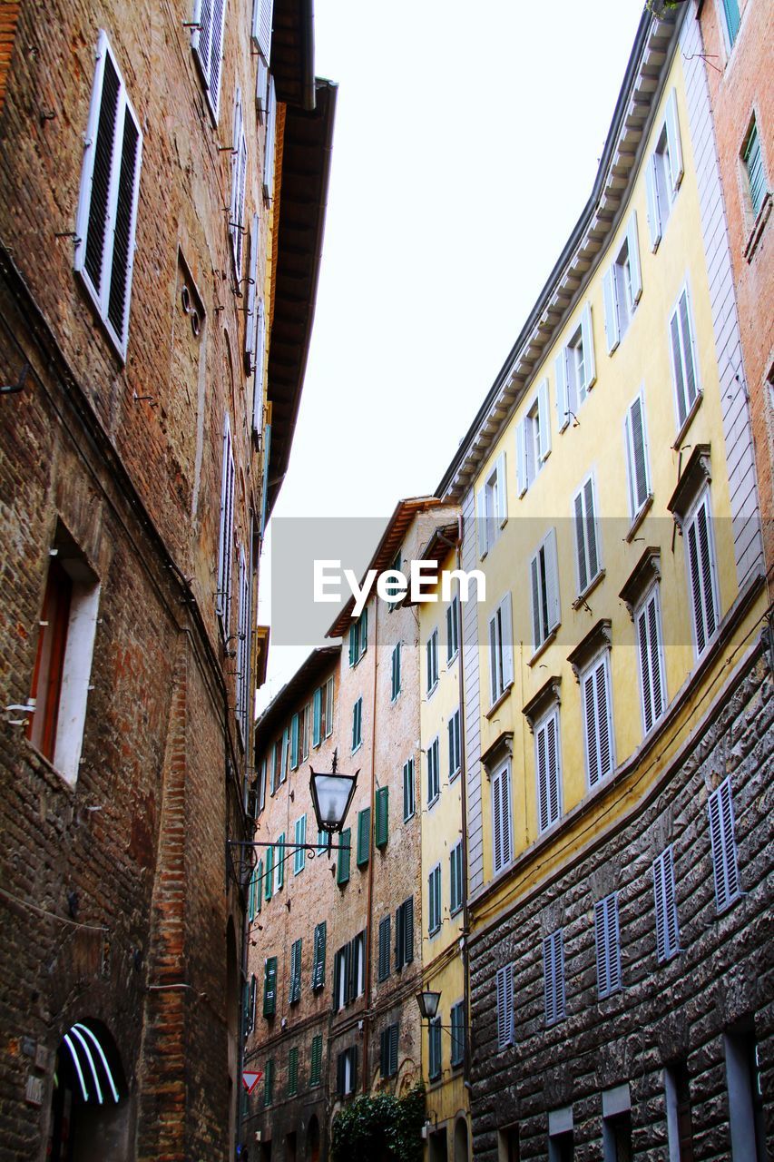 Traditional city buildings against clear sky