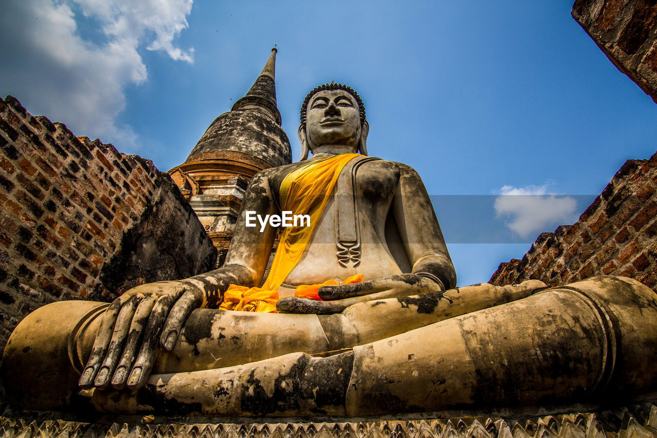 Low angle view of statue against sky