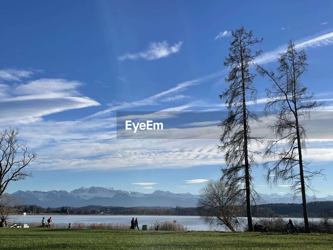 sky, cloud, plant, tree, nature, environment, land, landscape, grass, water, beauty in nature, scenics - nature, horizon, mountain, blue, rural area, tranquility, outdoors, field, tranquil scene, lake, day, non-urban scene, travel destinations, reflection, wind, no people, electricity, morning, rural scene