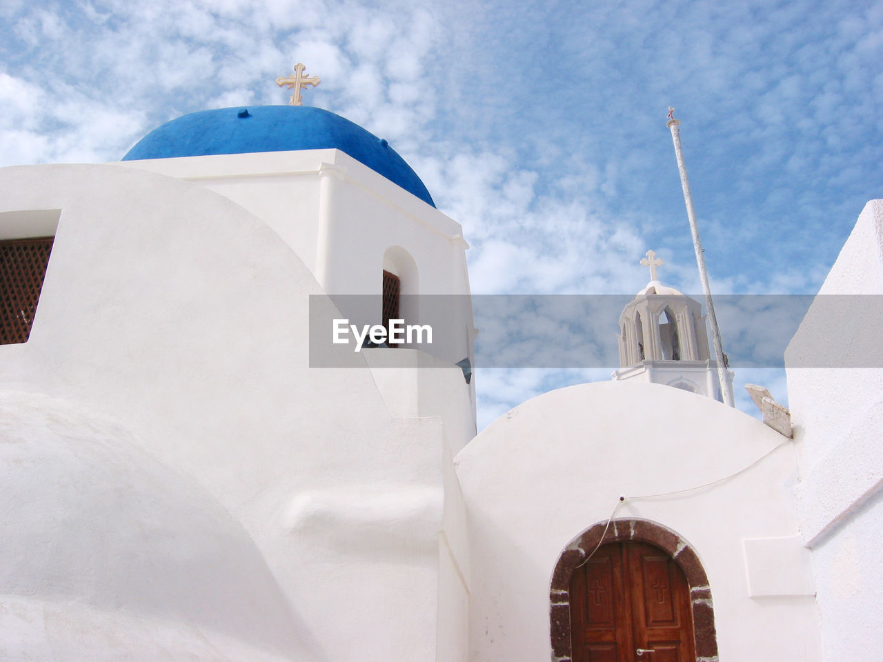 Low angle view of church against sky at santorini
