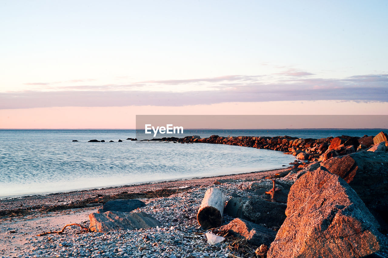 Scenic view of sea against sky at sunset