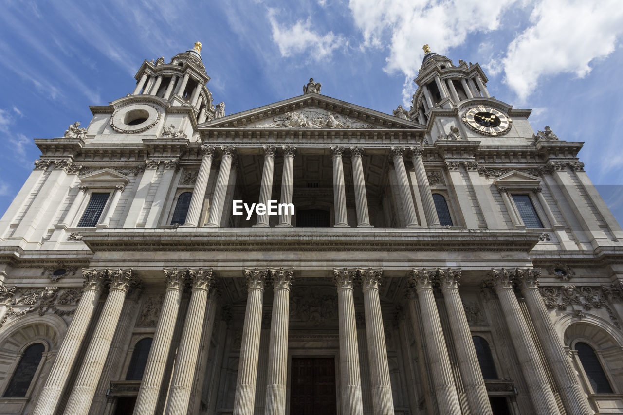 Low angle view of cathedral against cloudy sky