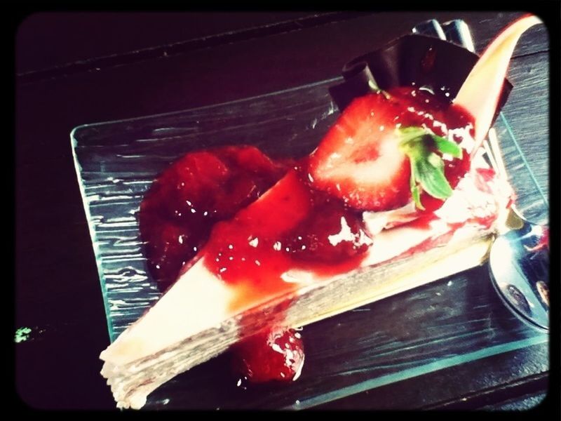 CLOSE-UP OF STRAWBERRY ON TABLE