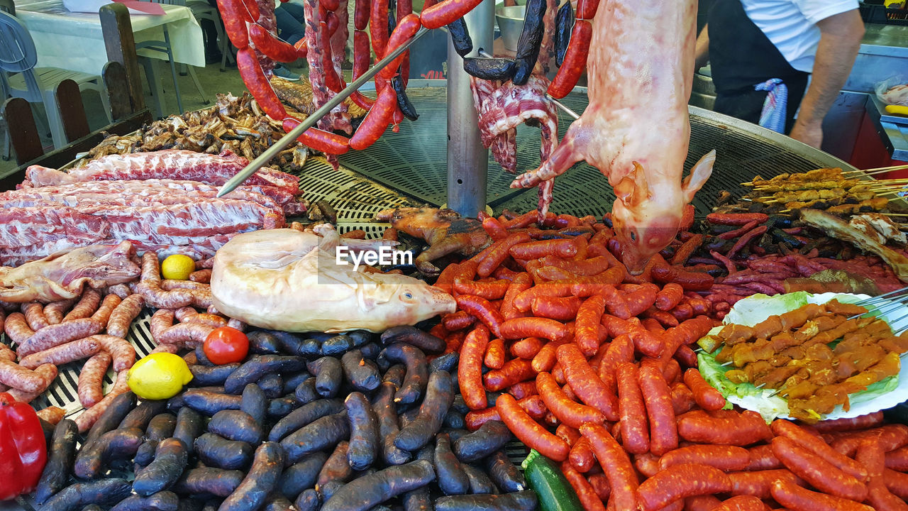 High angle view of  food for sale in market. great feast of meat and sausages