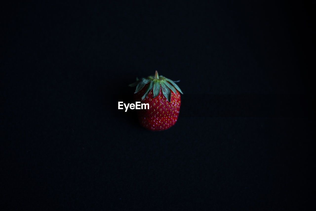 Close-up of strawberry against black background