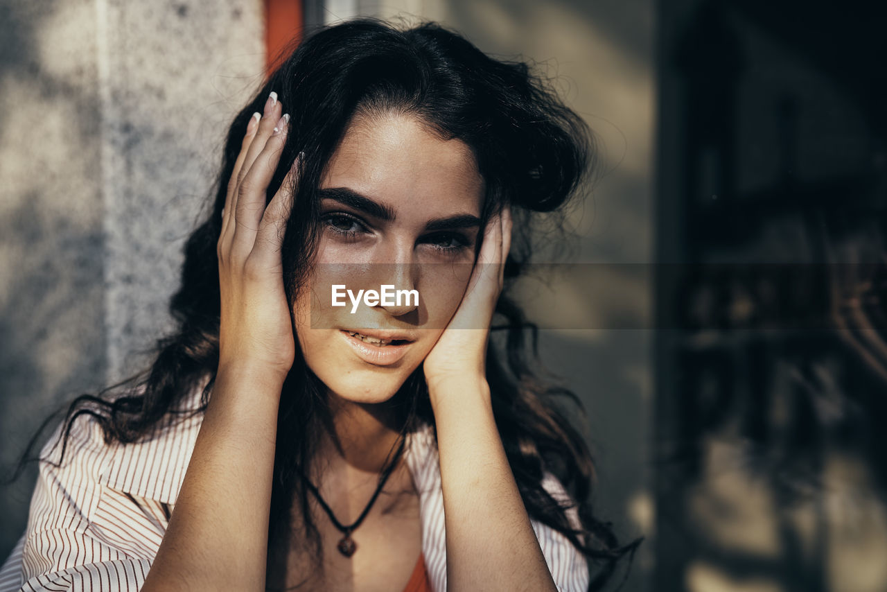 close-up of young woman looking away