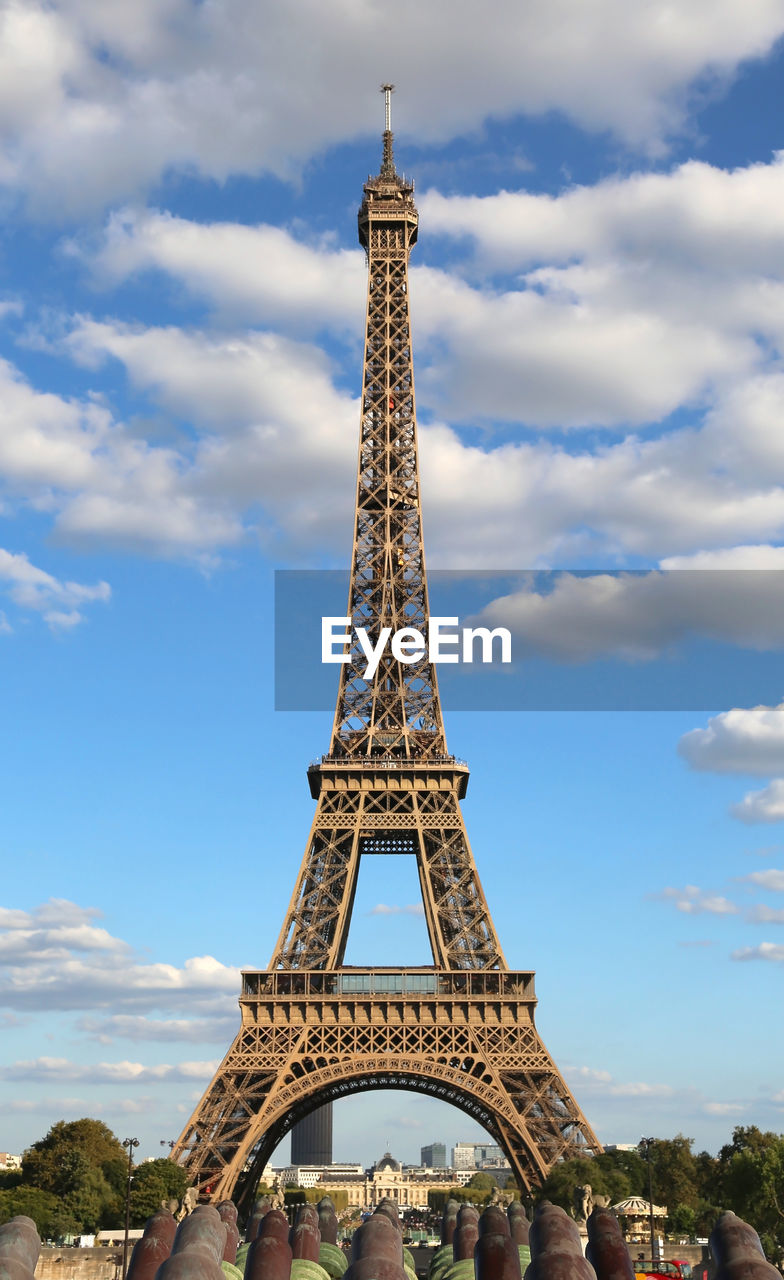 Eiffel tower in france paris in a summer day with clear sky and white clouds