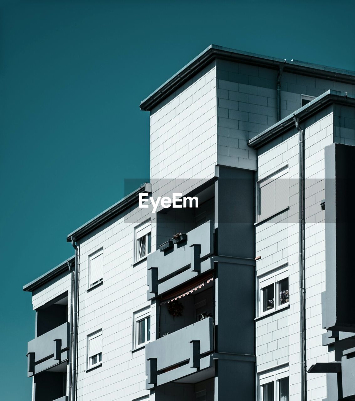 Low angle view of residential building against clear sky