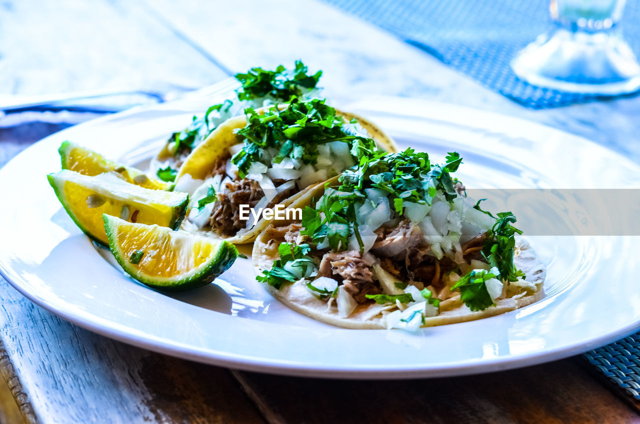 High angle view of tacos in plate on table