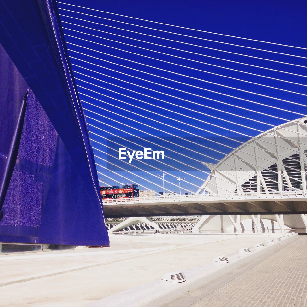 VIEW OF BRIDGE AGAINST BLUE SKY AND CLOUDS