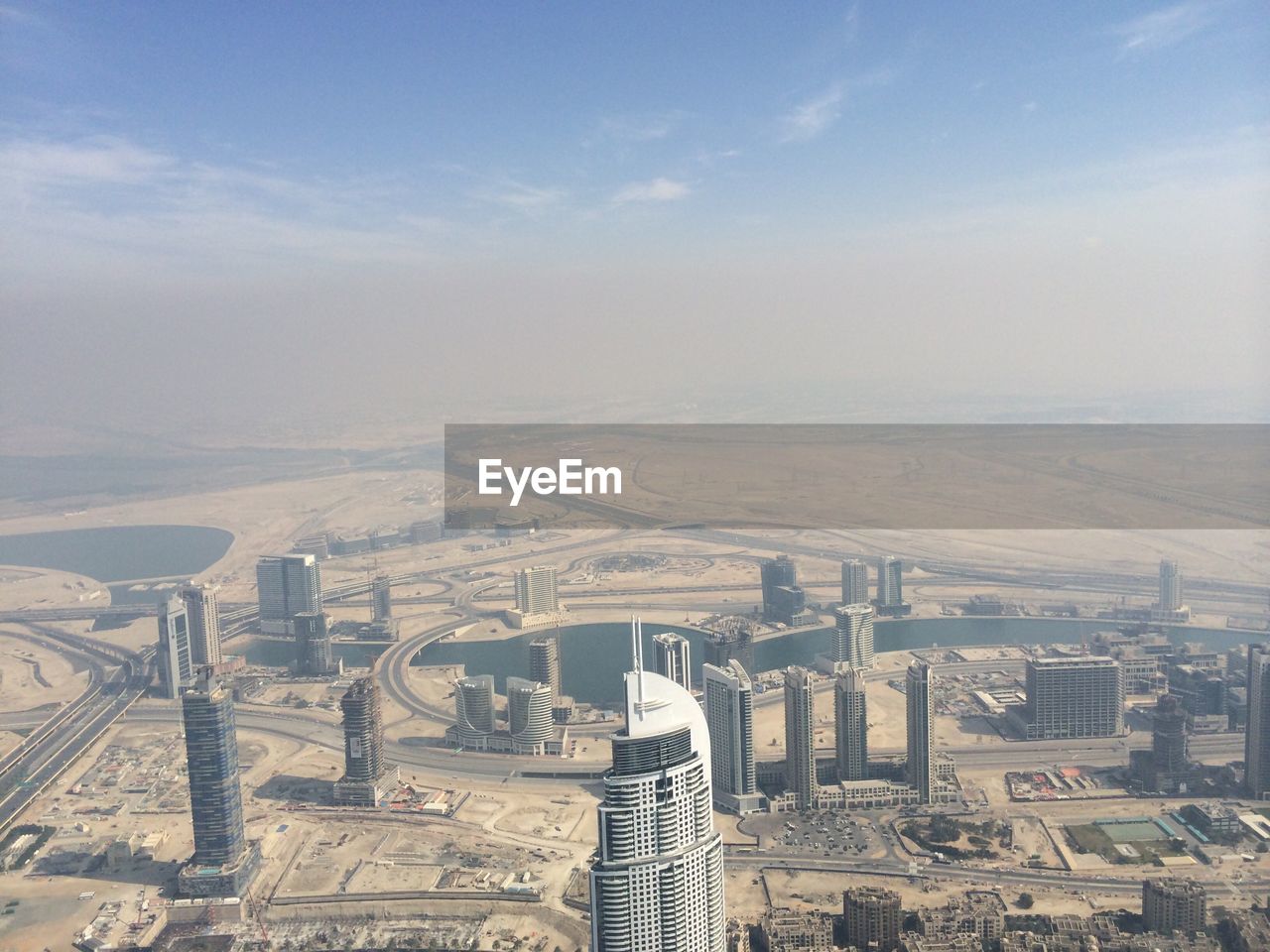 Aerial view of skyscrapers against sky