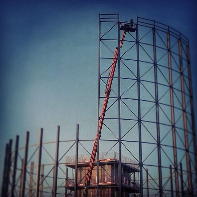 LOW ANGLE VIEW OF CRANE AGAINST SKY