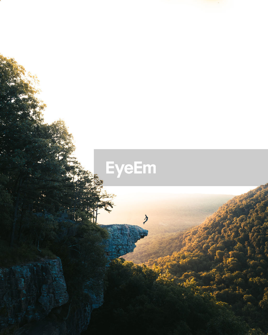 Person on mountain against sky