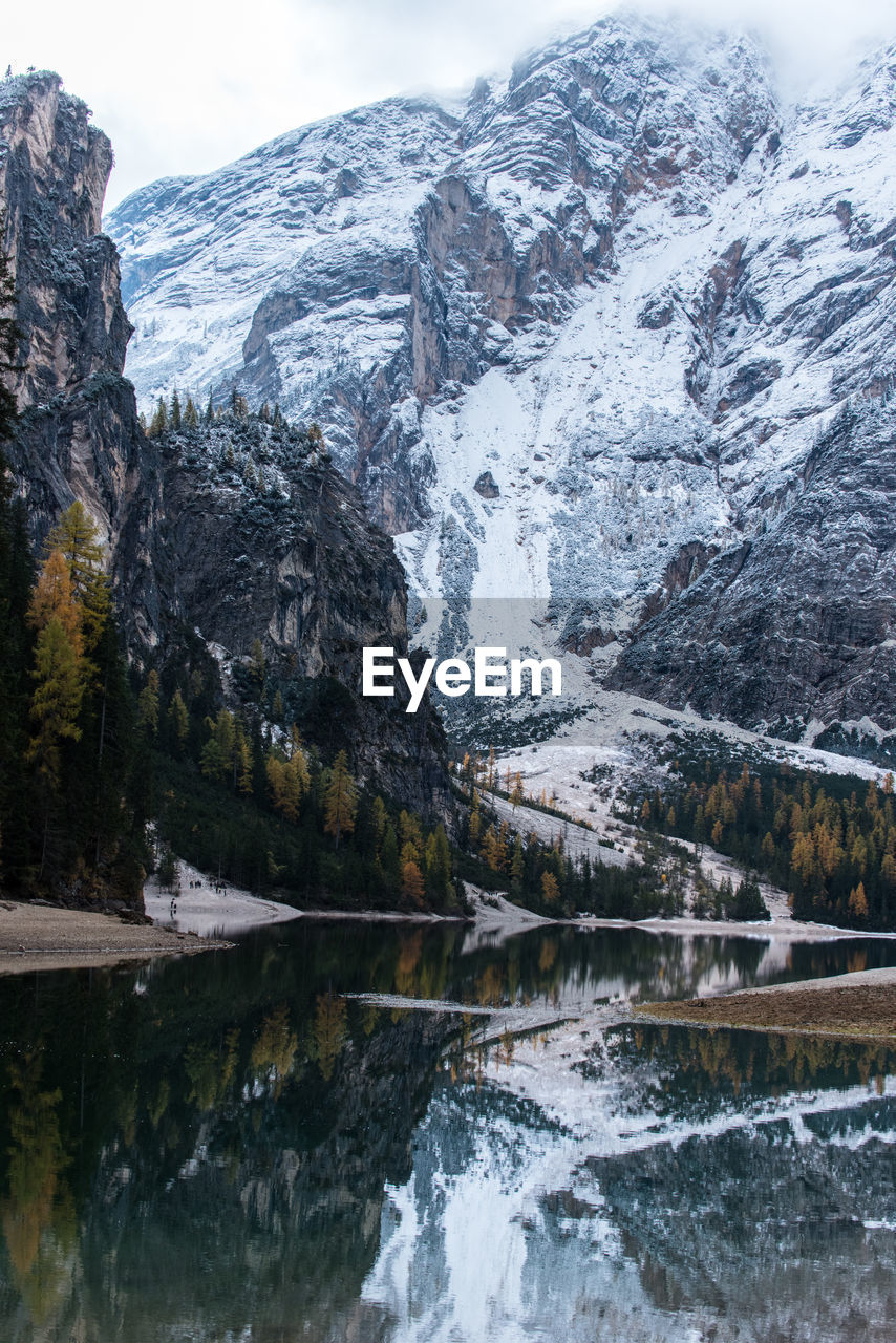 Scenic view of lake and mountains during winter