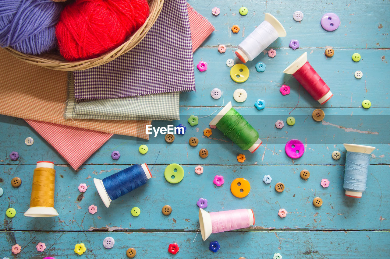 Directly above shot of multi colored sewing items on table