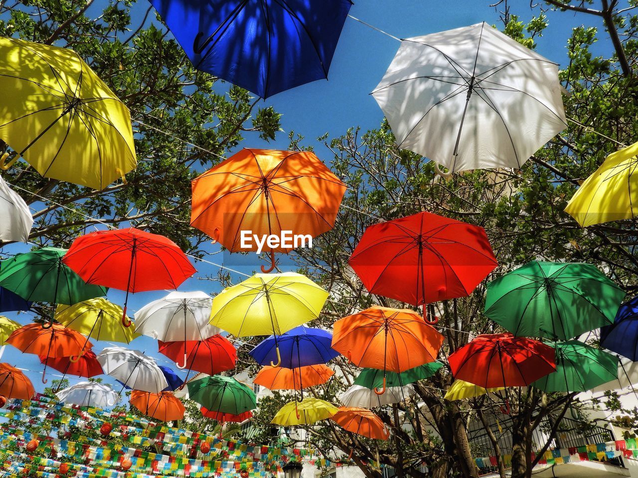 Umbrellas creating a sunshade over a street in spain