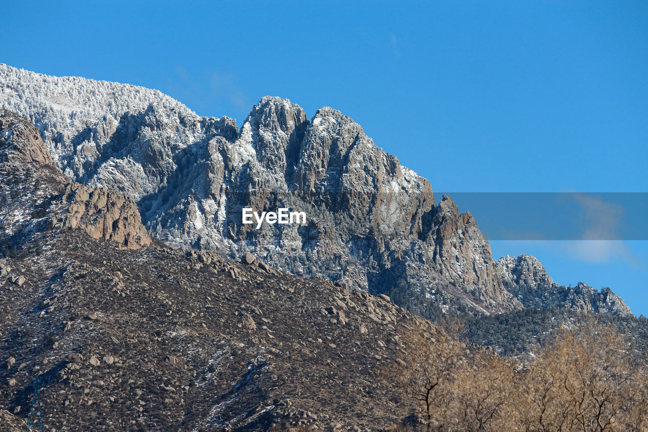 Scenic view of snowcapped mountain against sky. sandia mountains, albuquerque, new mexico