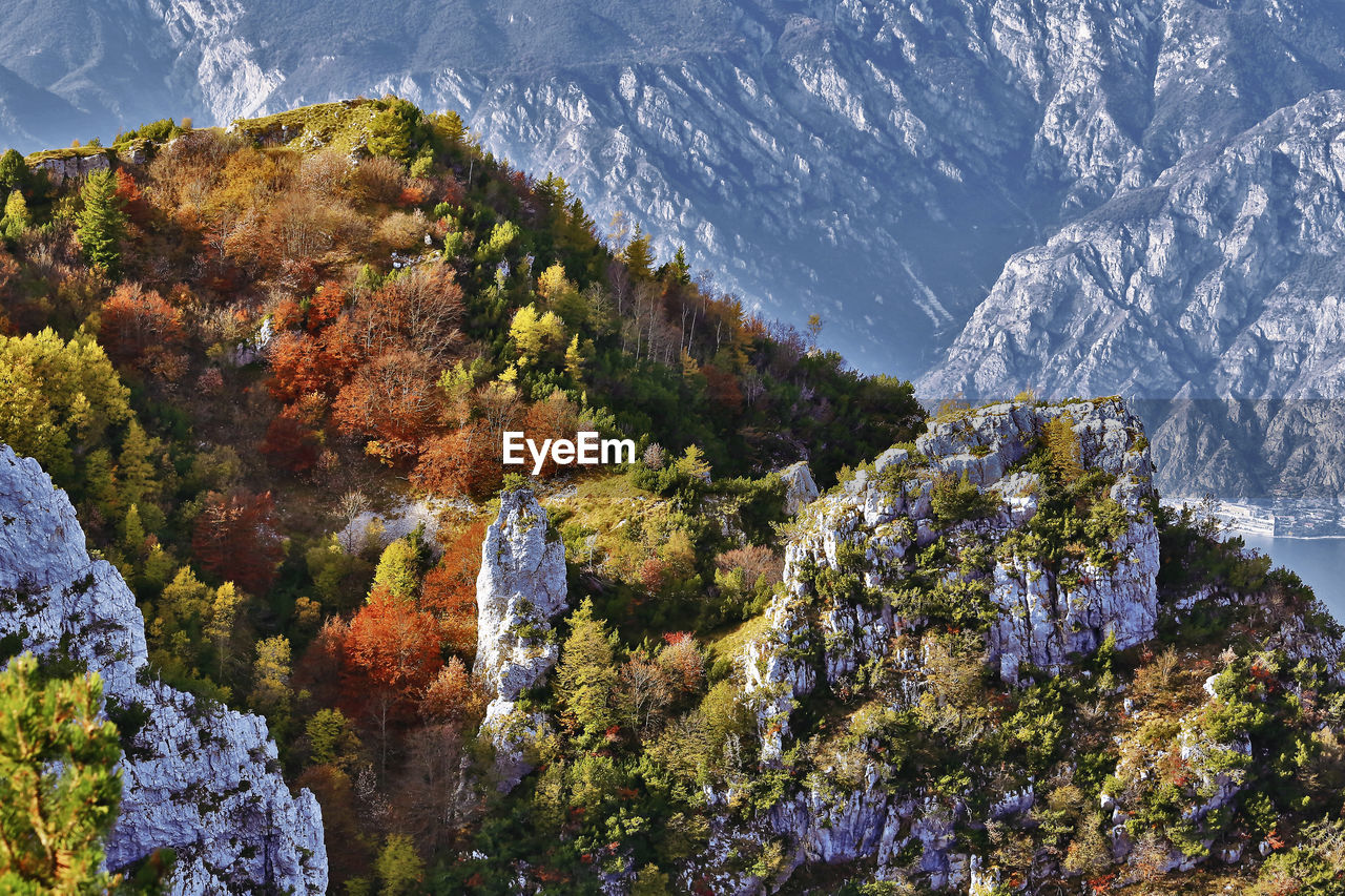 Ventrar hiking trail and autumn foliage on garda lake, trentino, italy