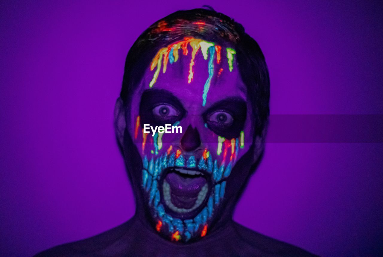 Neon painted skull man 