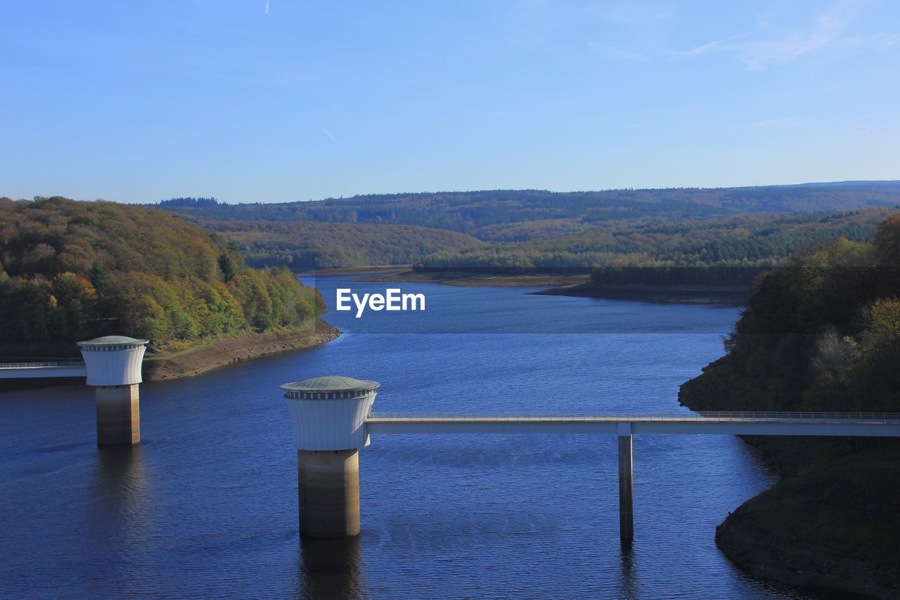 Scenic view of river against blue sky