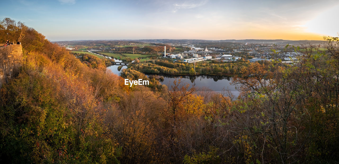 Scenic view of river against sky during autumn