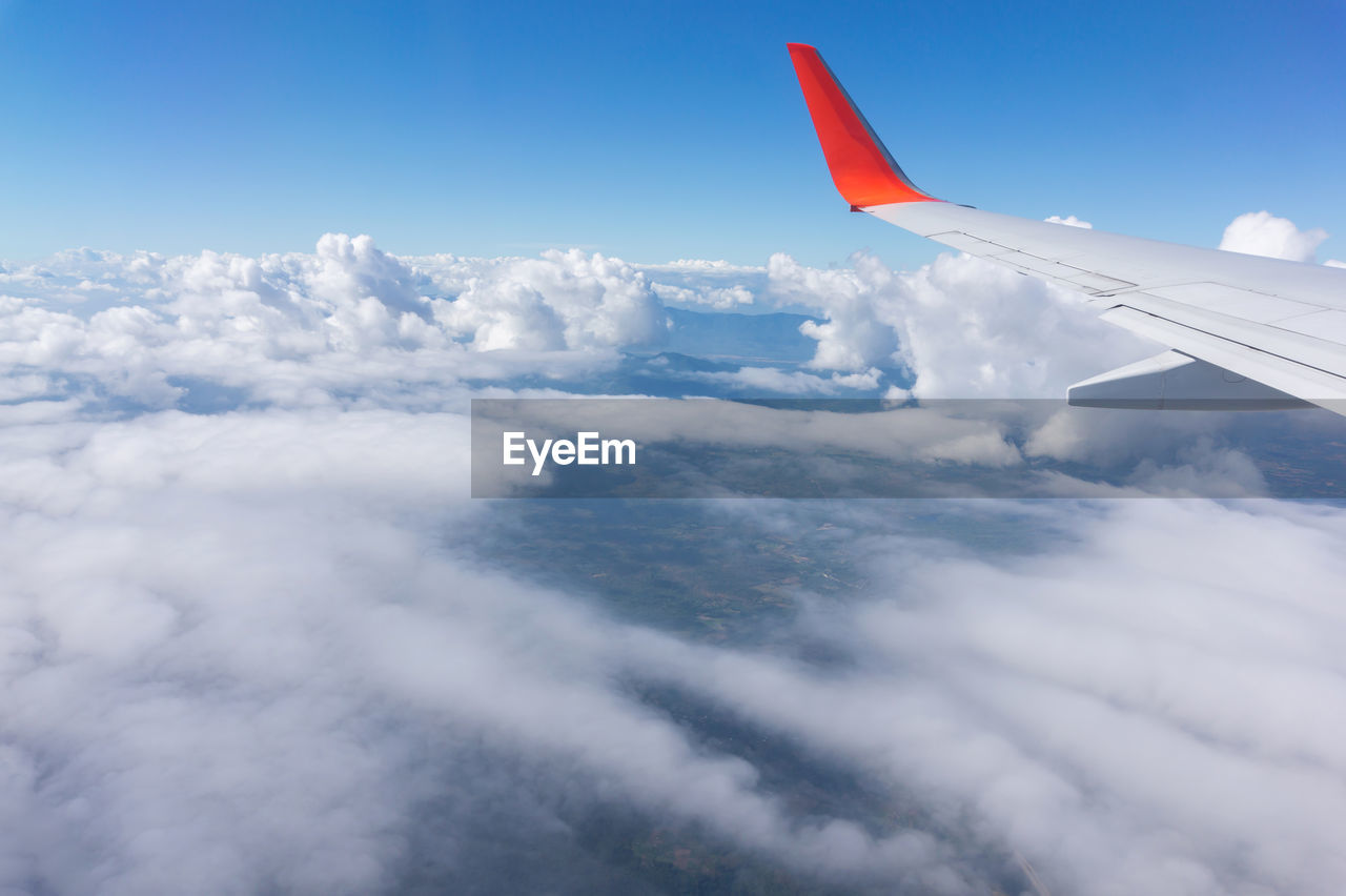AERIAL VIEW OF CLOUDSCAPE OVER AIRPLANE