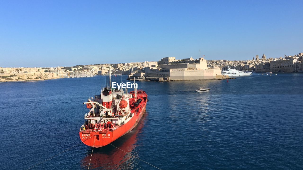 Scenic view of sea against clear blue sky