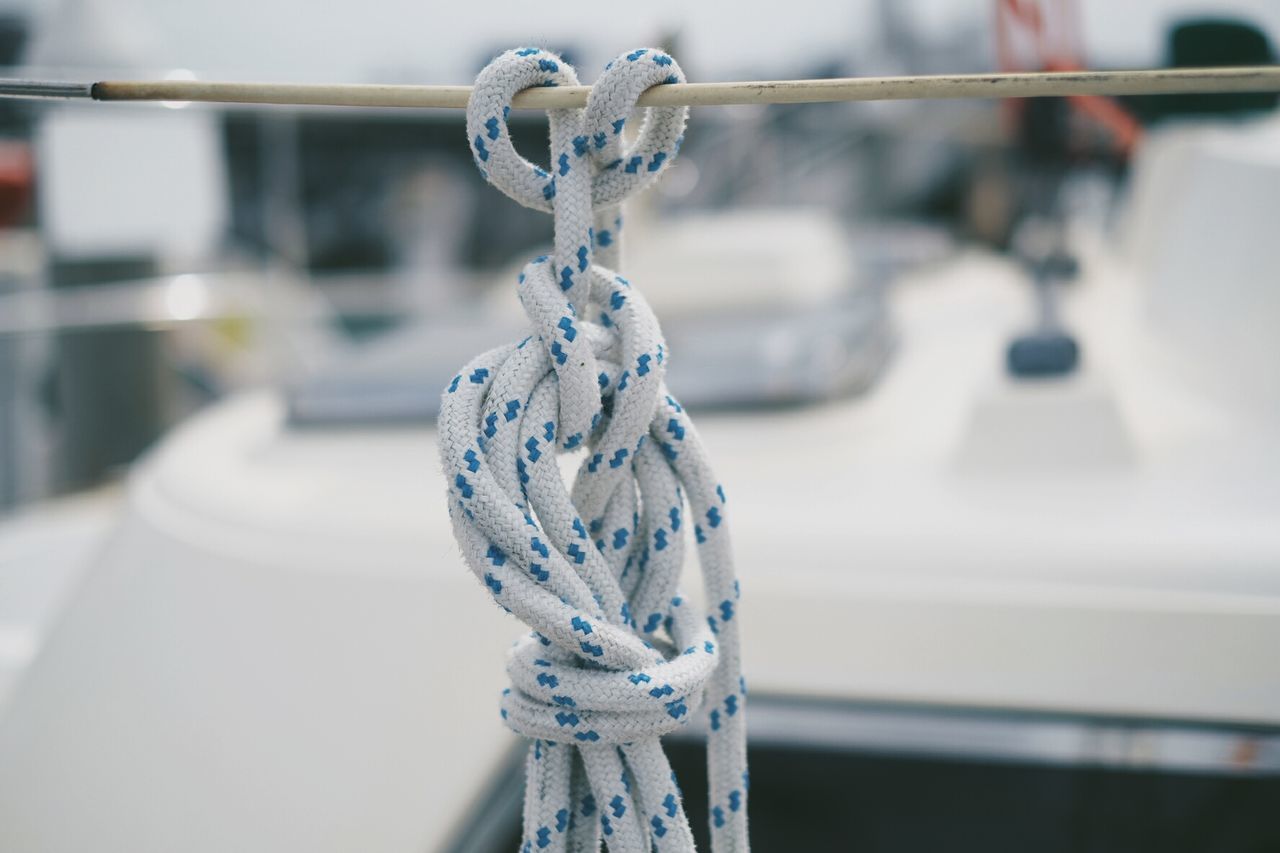 Close-up of rope tied on cable