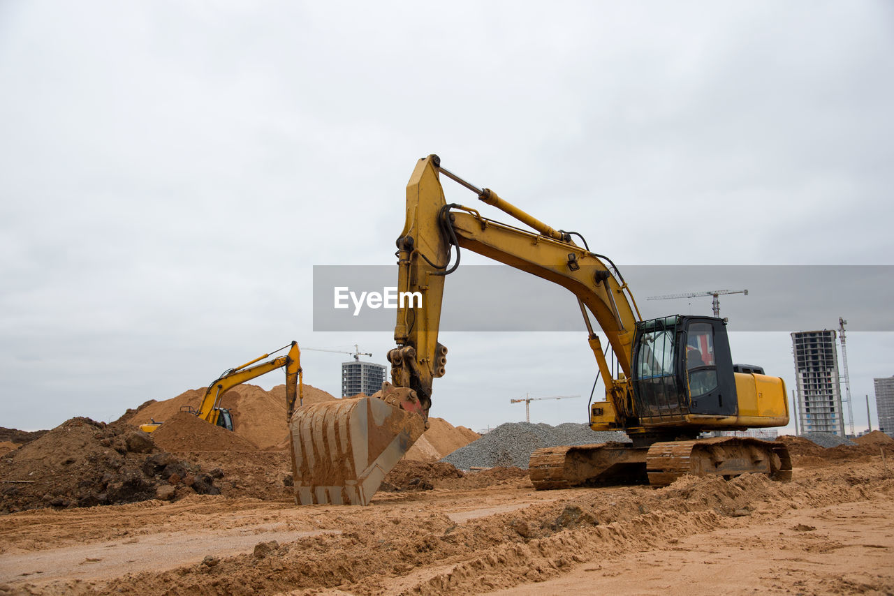 Excavator at building under construction. backhoe digs the ground for the foundation 