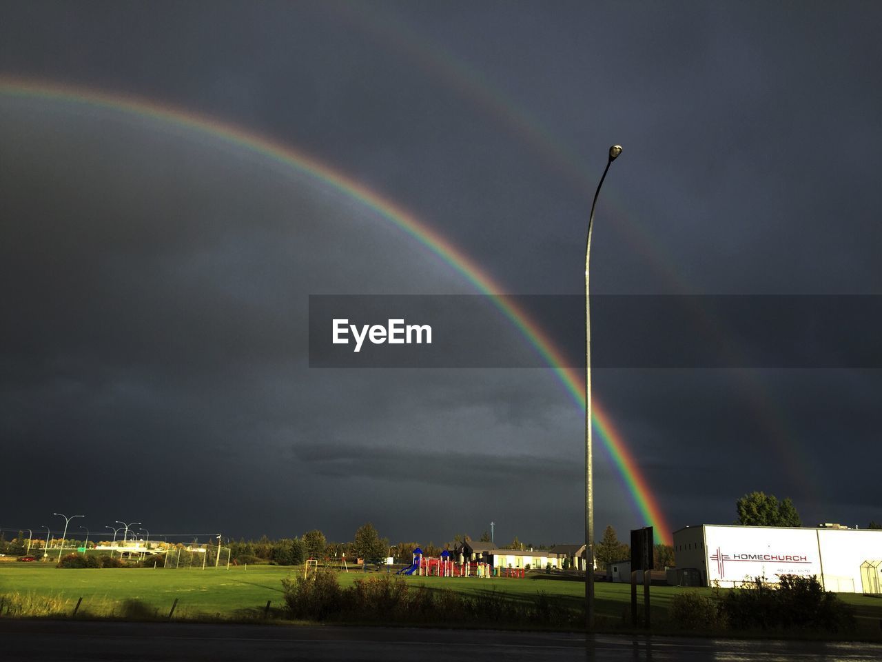 SCENIC VIEW OF RAINBOW OVER TOWN