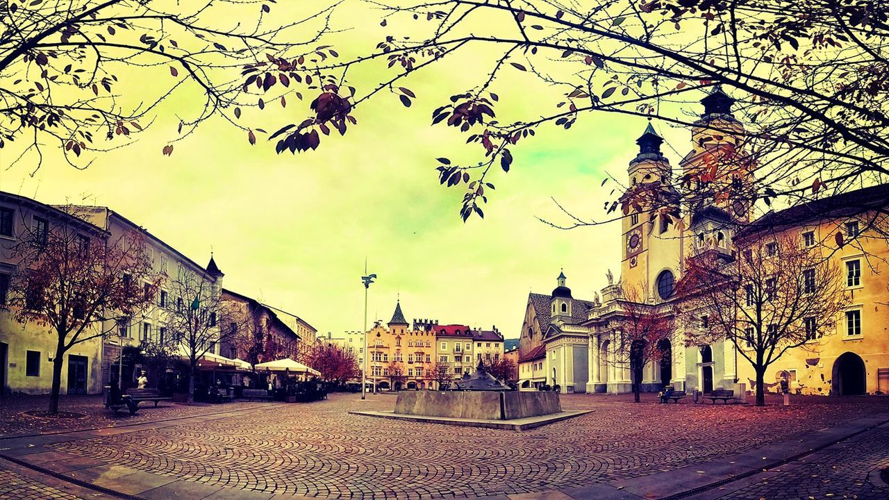 Cobblestone street along buildings in the background