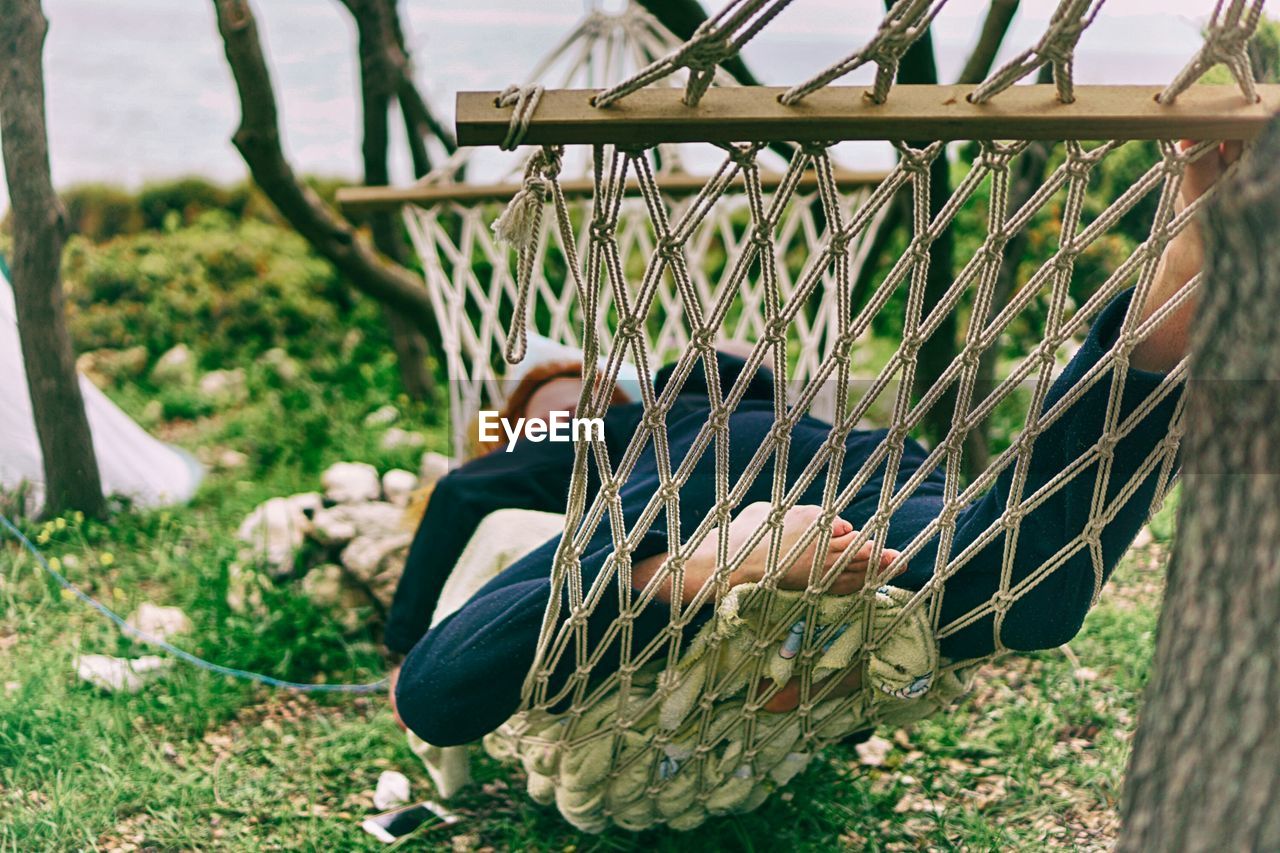 People lying on hammock during campaign