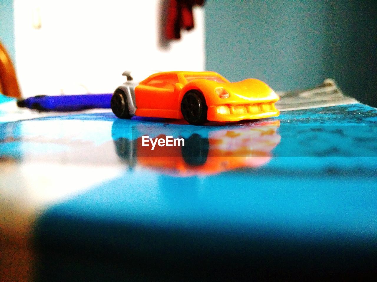 CLOSE-UP OF TOY CAR IN CONTAINER