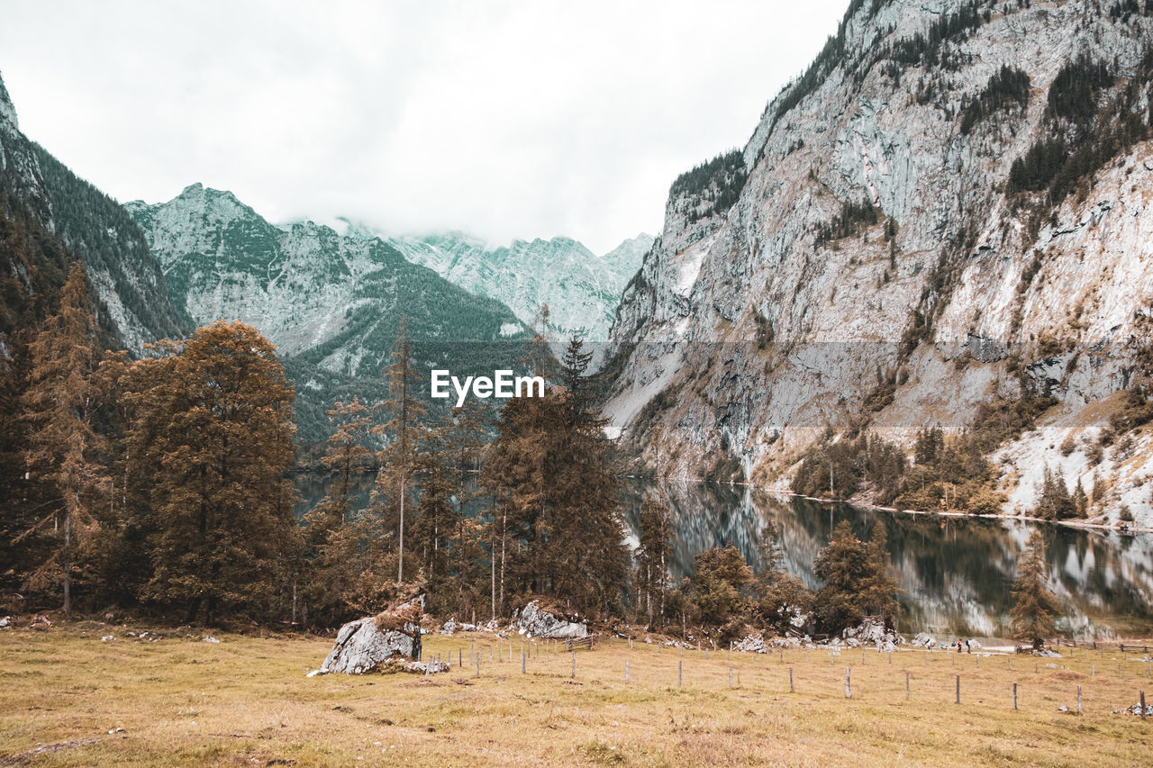 Scenic view of landscape and mountains against sky