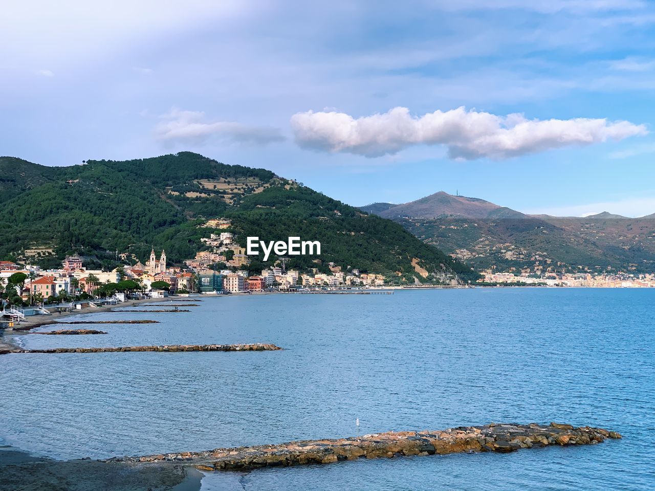 SCENIC VIEW OF SEA BY CITY AGAINST SKY