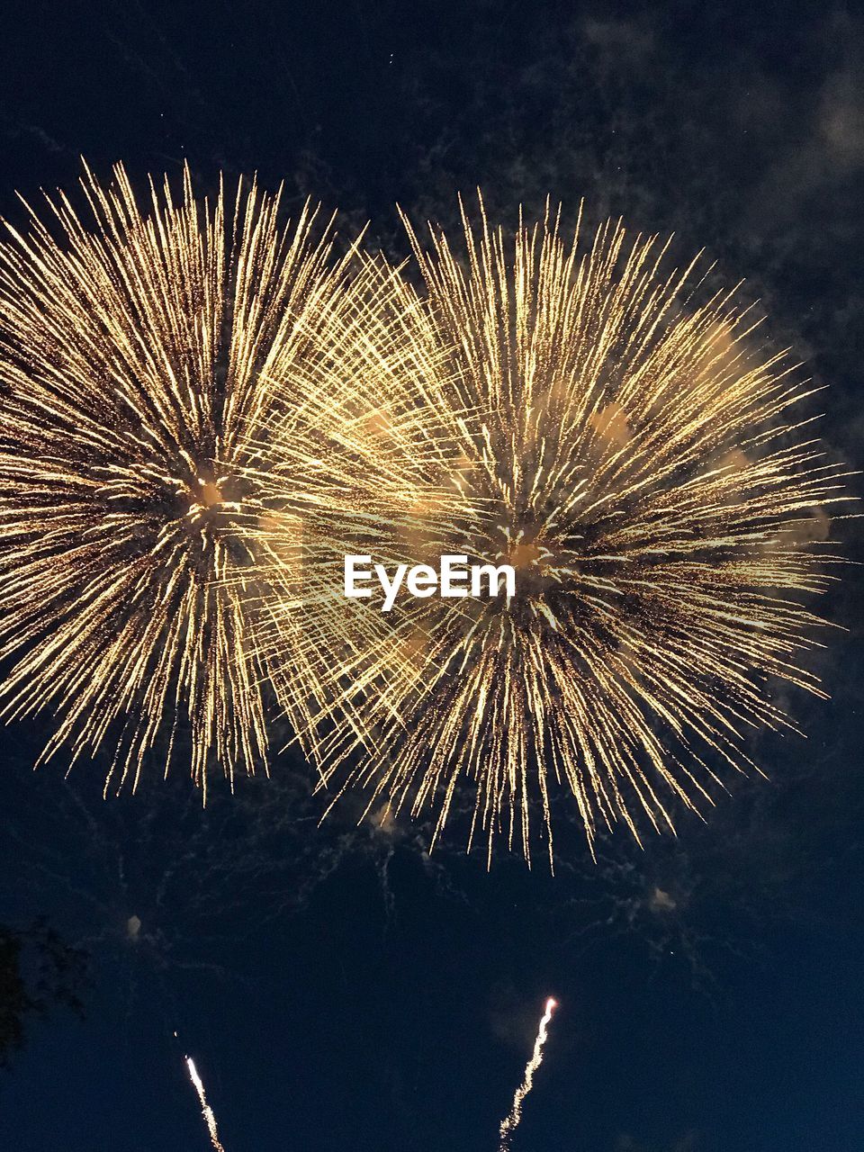 LOW ANGLE VIEW OF FIREWORK DISPLAY