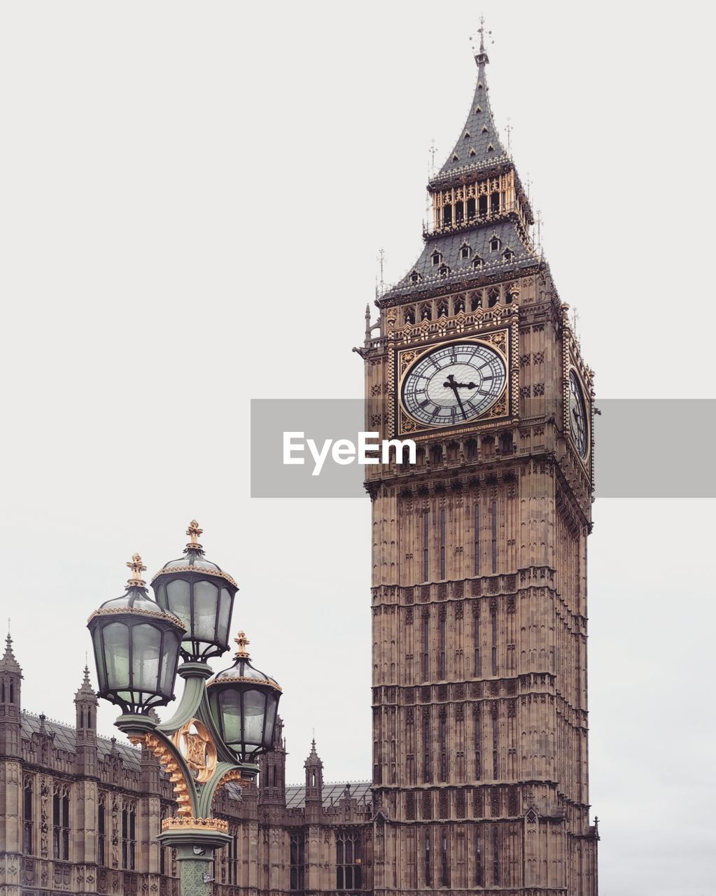 Low angle view of clock tower against sky