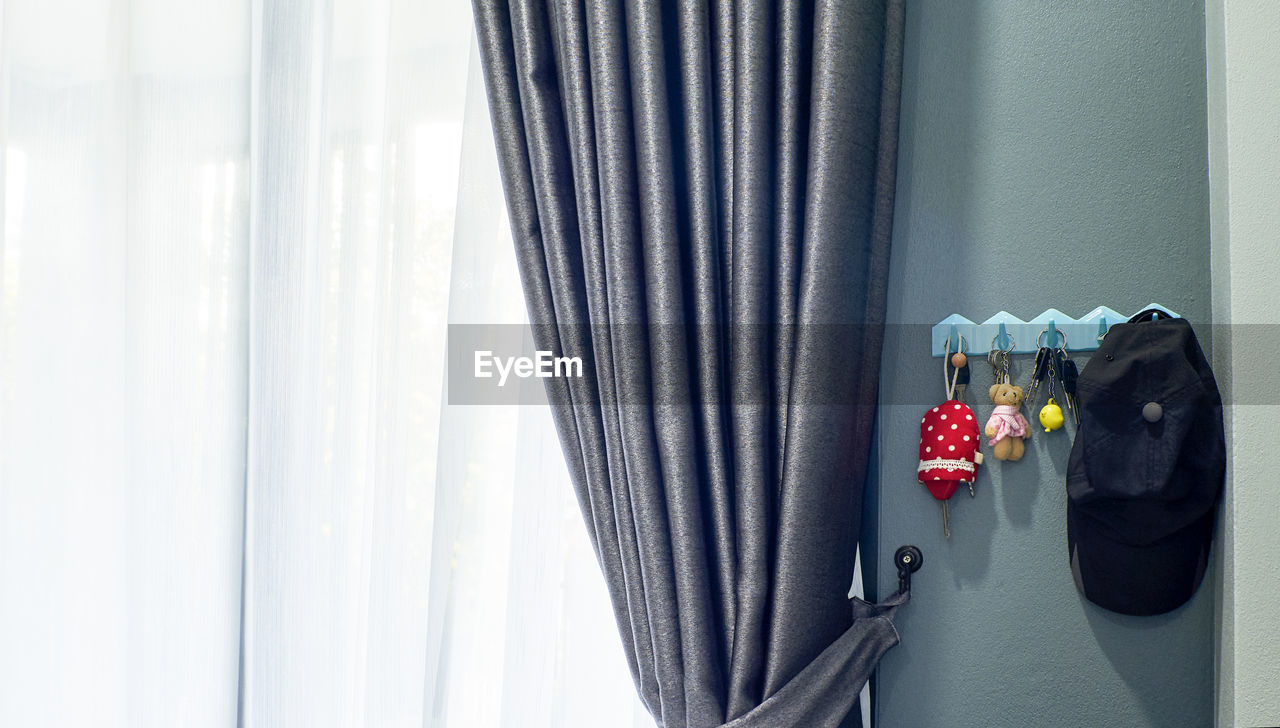 CLOSE-UP OF WINDOW SILL ON CURTAIN