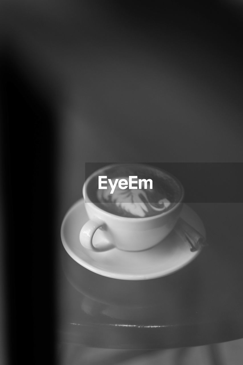 Close-up of coffee cup on table