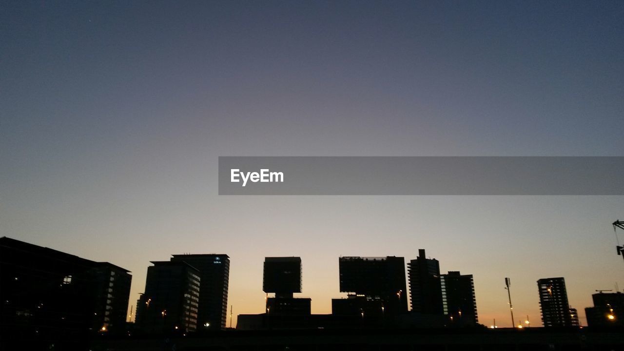 Silhouette of skyscrapers at dusk