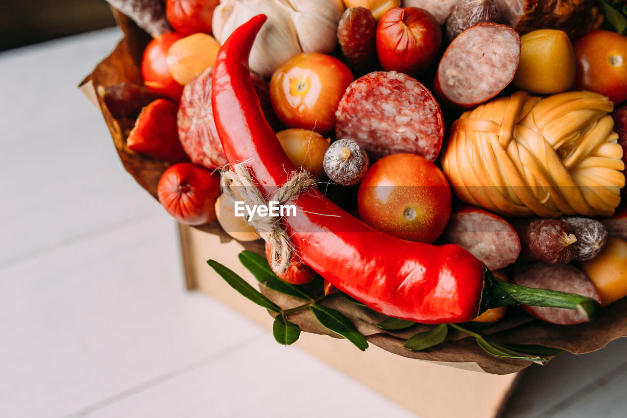 Delicious edible bouquet of sausage, tomatoes, cheese. gift for man.