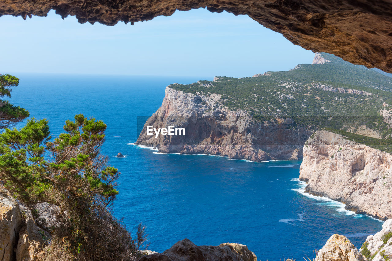 HIGH ANGLE VIEW OF SEA AND ROCK FORMATION