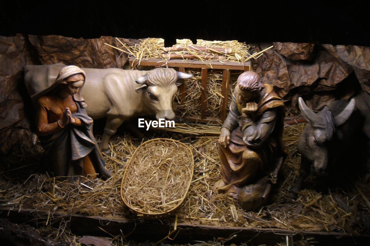 High angle view of figurines in church during christmas